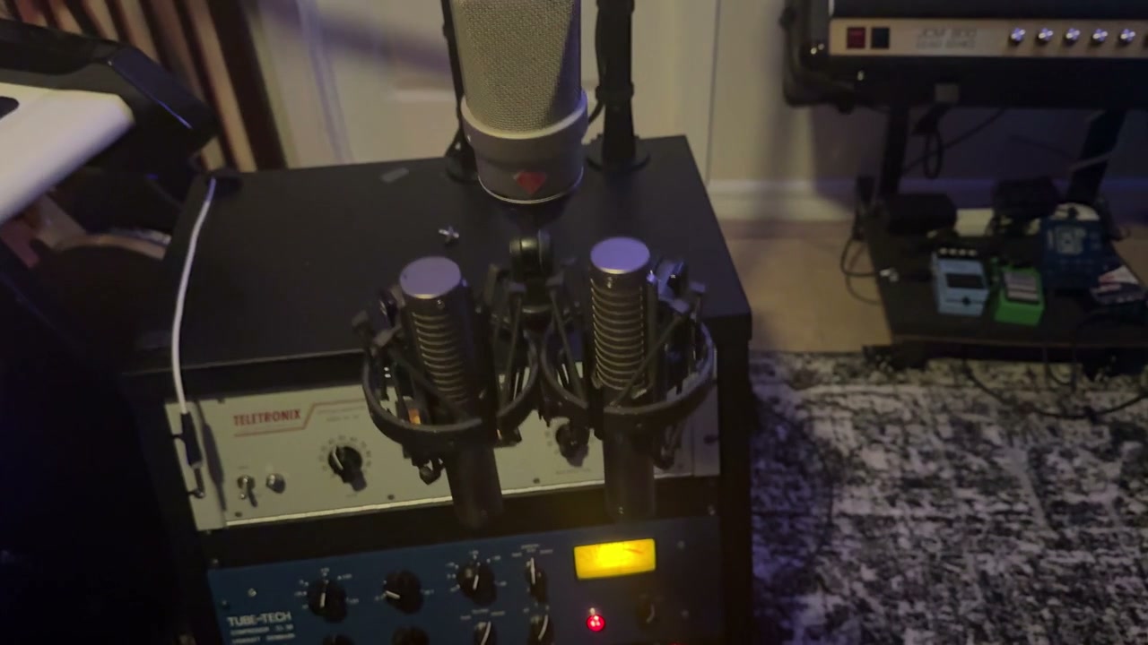 Studio video showing microphones beside the outboard rack